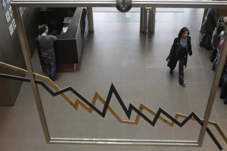 A woman walks inside a hall of the Athens Stock Exchange in Athens