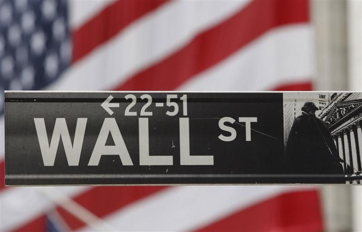 The Wall Street sign is seen in front of the New York Stock Exchange