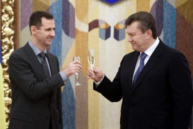 Ukraine's President Viktor Yanukovich toasts with Syria's President Bashar al-Assad in Kiev in December 2010.