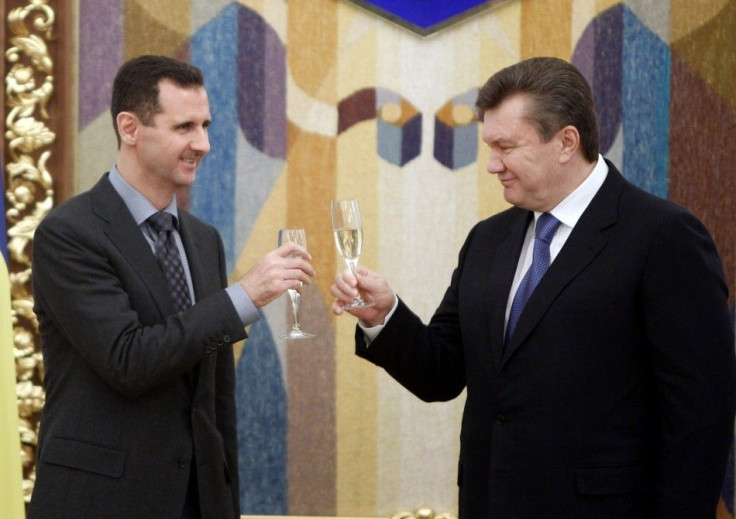 Ukraine's President Viktor Yanukovich toasts with Syria's President Bashar al-Assad in Kiev in December 2010.