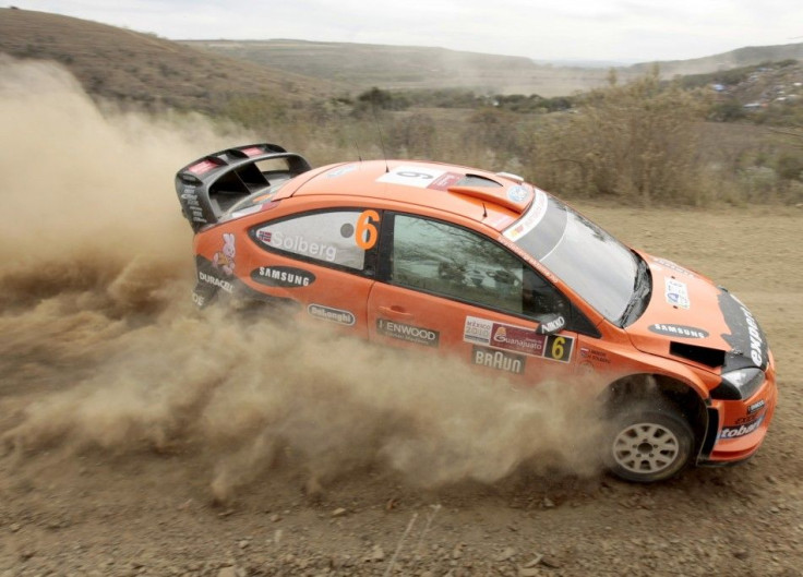 A Ford Focus RS kicks up some dust in WRC Rally Mexico 2010.
