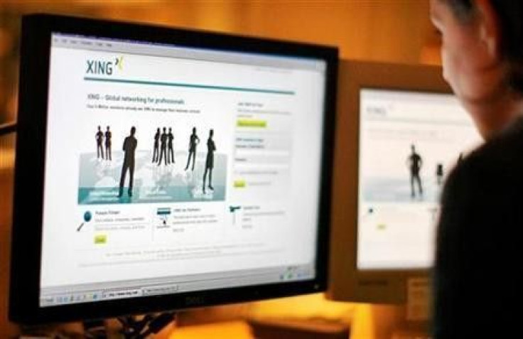 A web-user views the global networking site called Xing in Stockholm, November 20, 2008
