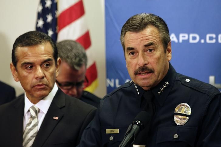 LAPD Police Chief Charlie Beck (R) speaks as Los Angeles Mayor Antonio Villaraigosa