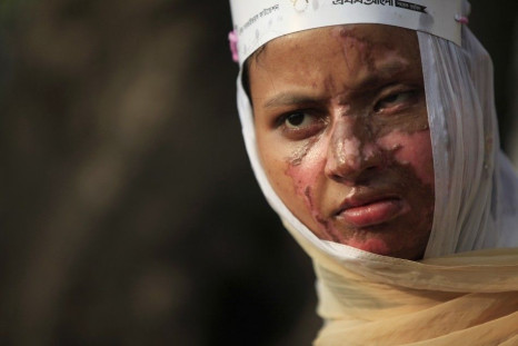  Sultana, a survivor of an acid attack, takes part in an awareness rally about the violence against women as they commemorate International Women's Day in Dhaka