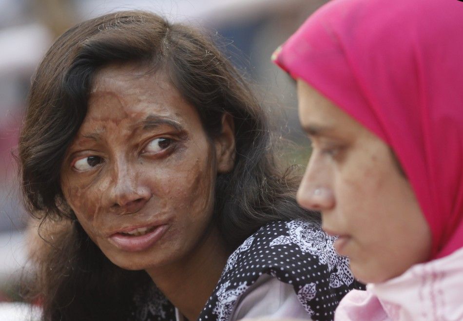Survivor of acid attack takes part in an awareness rally about the violence against women in Dhaka