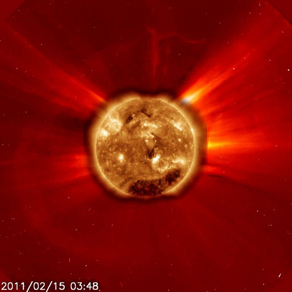 This image of a large X2 flare from the Sun taken on February 15, 2011, as seen by Solar Dynamics Observatory SDO in extreme ultraviolet light has been enlarged and superimposed on SOHOs C2 coronagraph for the same period, in this photograph released b