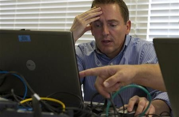 Cyber security analysts work to defend a network during a drill at a Department of Homeland Security cyber security defense lab at the Idaho National Laboratory in Idaho Falls, Idaho, September 30, 2011.