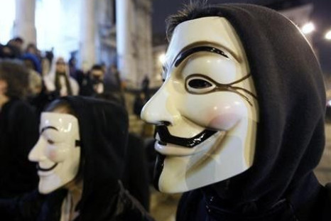 A protester wearing a Guy Fawkes mask, symbolic of the hacktivist group &#039;&#039;Anonymous&#039;&#039;, takes part in a protest in central Brussels January 28, 2012.