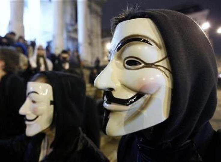 A protester wearing a Guy Fawkes mask, symbolic of the hacktivist group &#039;&#039;Anonymous&#039;&#039;, takes part in a protest in central Brussels January 28, 2012.