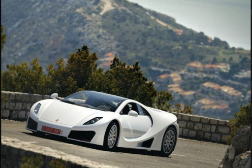 A GTA Spano drives. The GTA Spano was debuted at the Geneva Motor Show 2012.