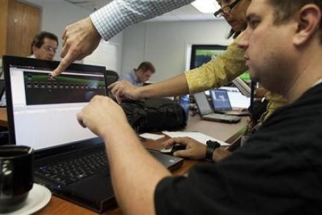 Attacking team members work to hack into a network during a drill at a Department of Homeland Security cyber security defense lab at the Idaho National Laboratory in Idaho Falls, Idaho, September 30, 2011.