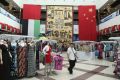 A shopper walks at the Dragonmart mall in Dubai, February 26, 2012.
