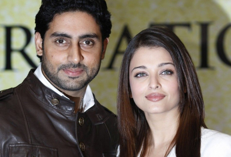 Actors Abhishek Bachchan and wife Aishwarya Rai Bachchan pose during a photocall in London