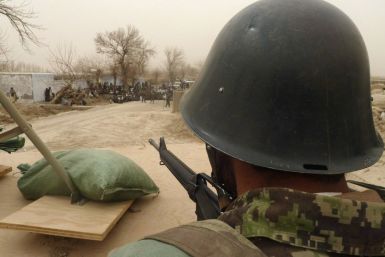 Afghan National Army soldier keeps watch inside a U.S. base in Panjwai district Kandahar