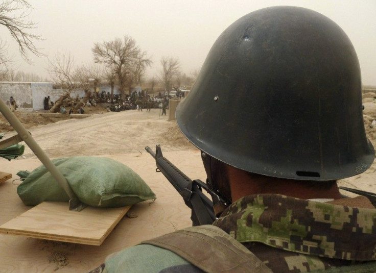 Afghan National Army soldier keeps watch inside a U.S. base in Panjwai district Kandahar