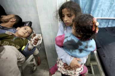 Wounded Palestinian children are seen in a hospital in the northern Gaza Strip, after an Israeli air strike