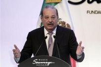 Mexican tycoon Carlos Slim speaks during the opening of the Soumaya museum in Mexico City March 1, 2011.