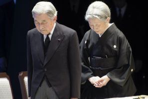 Japanese Emperor Akihito and Empress Michiko, bow during the national memorial service for tsunami and earthquake victims in Tokyo