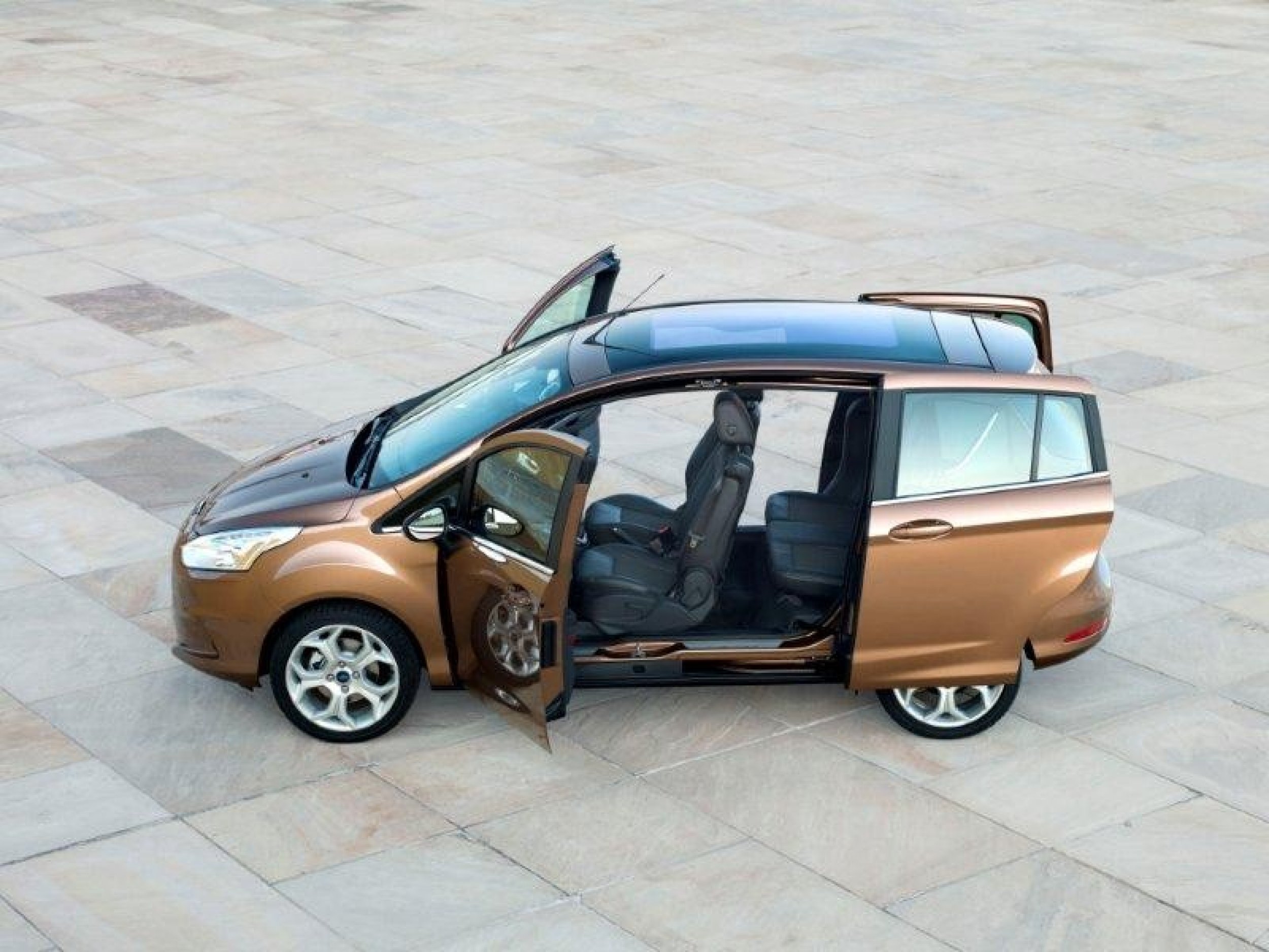 A Ford B-Max with its doors open.