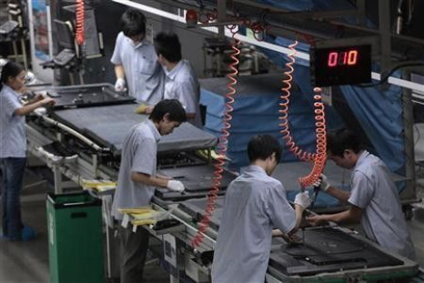 TCL Multimedia employees work at a production line in a factory in Huizhou, in China&#039;s southern Guangdong province October 8, 2010.
