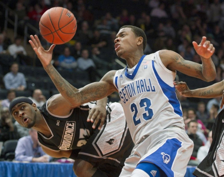 Seton Hall Pirates Fuquan Edwin grabs a rebound in front of Providence Friars LaDontae Henton during their NCAA men&#039;s championship basketball game at the 2012 Big East Tournament in New York