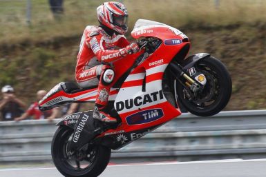 Ducati MotoGP rider Hayden of the U.S. performs a wheelie.