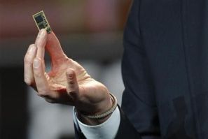 Hans Vestberg, president and chief executive of the Ericsson Group, holds a ST-Ericsson 4G LTE chip during his keynote address at the 2012 International Consumer Electronics Show (CES) in Las Vegas, Nevada, January 11, 2012.