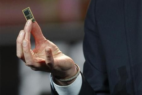 Hans Vestberg, president and chief executive of the Ericsson Group, holds a ST-Ericsson 4G LTE chip during his keynote address at the 2012 International Consumer Electronics Show (CES) in Las Vegas, Nevada, January 11, 2012.