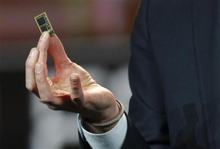 Hans Vestberg, president and chief executive of the Ericsson Group, holds a ST-Ericsson 4G LTE chip during his keynote address at the 2012 International Consumer Electronics Show (CES) in Las Vegas, Nevada, January 11, 2012.