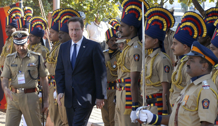 Britain's Prime Minister David Cameron arrives to pay tributes at a memorial dedicated to policemen who lost their lives in November 2008 attacks, in Mumbai February 18, 2013.