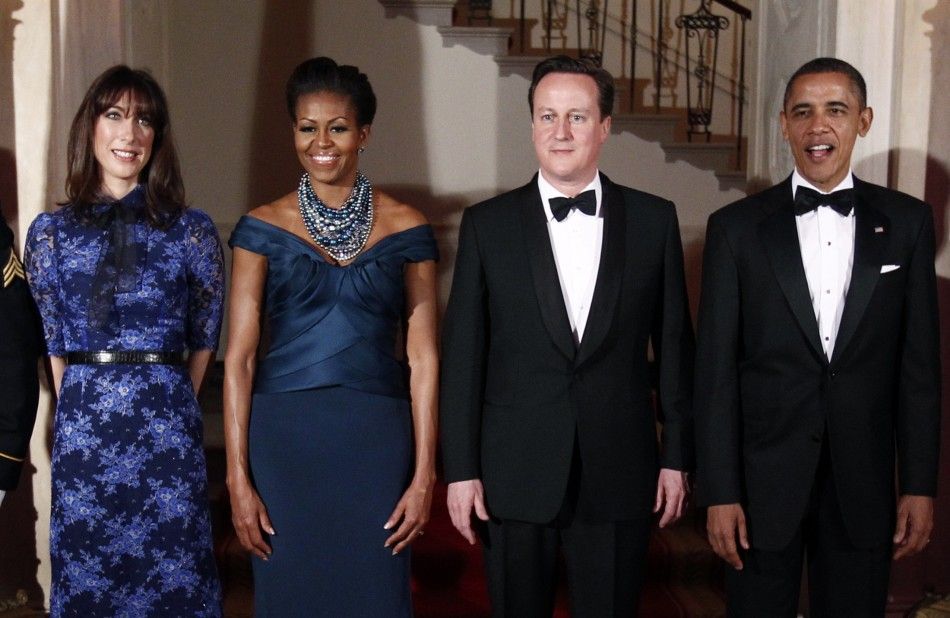 U.S. President Barack Obama R and first lady Michelle 2nd L welcome British Prime Minister David Cameron and his wife Samantha to the White House for a State Dinner in Washington March 14, 2012. 