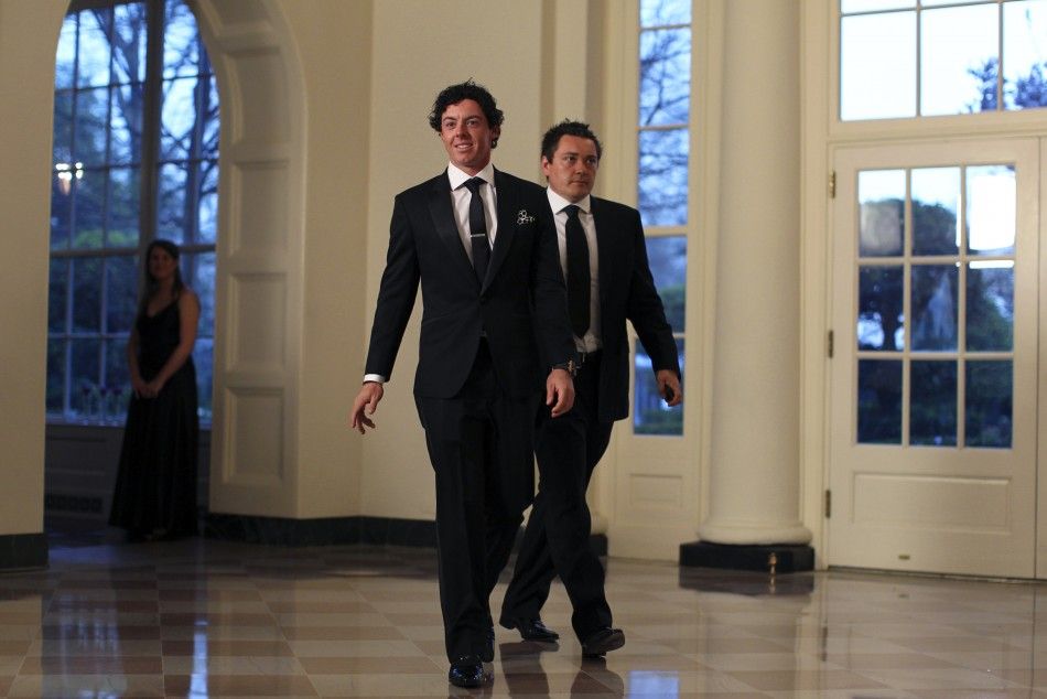Golfer Rory McIlroy and Conor Ridge R arrive for a State Dinner held in honor of Britains Prime Minister David Cameron and his wife Samantha at the White House in Washington March 14, 2012.