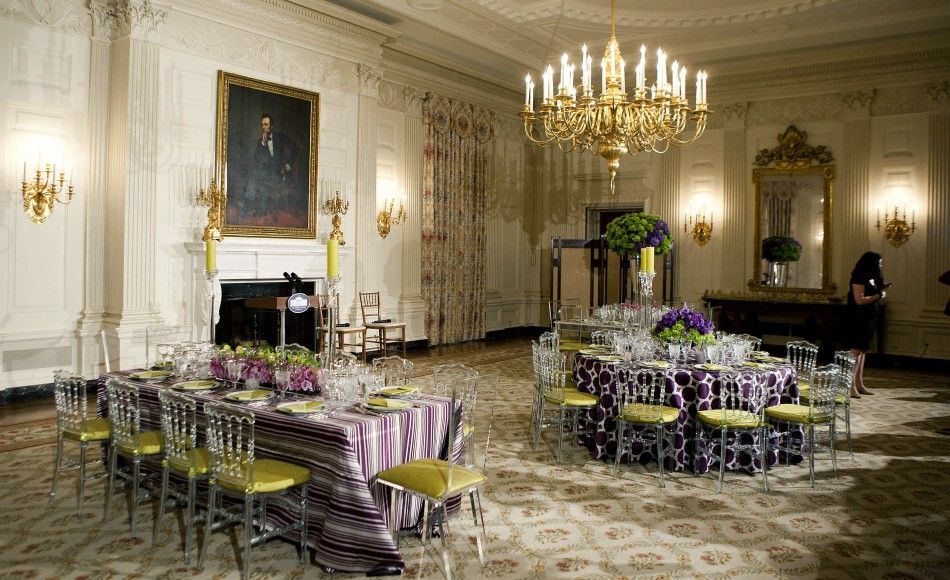 A table setting for the State Dinner with U.S. President Barack Obama and Britain Prime Minister David Cameron, is shown during a preview in the State Dining Room at the White House in Washington March 14, 2012.