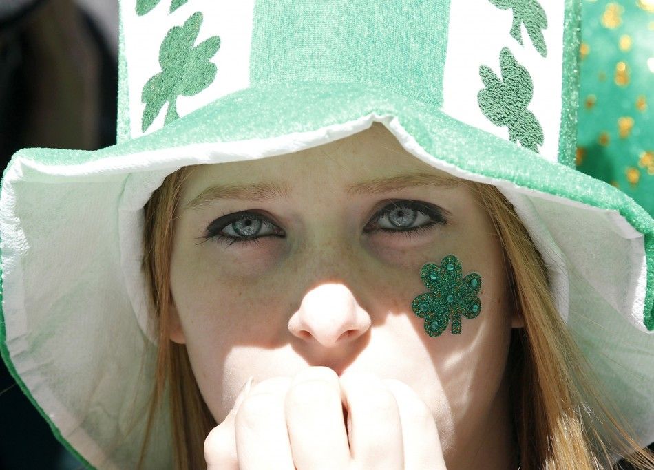 A young woman watches the New York Citys 250th annual St. Patricks Day parade, March 17, 2011.