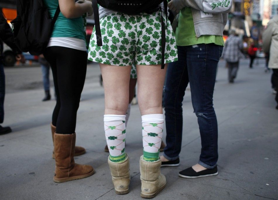 A woman wearing shamrock shorts stands with other revellers along 5th Avenue in New York during the citys 250th annual St. Patricks Day parade, March 17, 2011. 