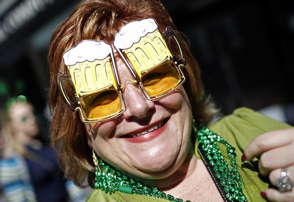 A woman wears beer mug glasses as she joins thousands of revellers celebrating along 5th Avenue in New York during the citys 250th annual St. Patricks Day parade, March 17, 2011. 