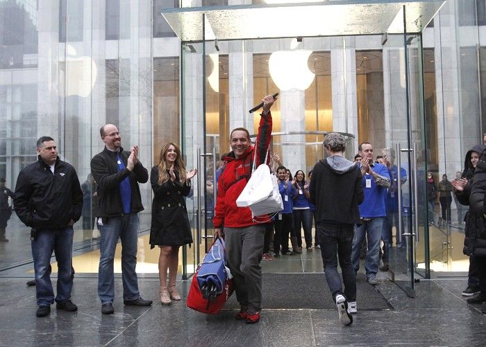 A man raises Apples new iPad after purchasing it in New York