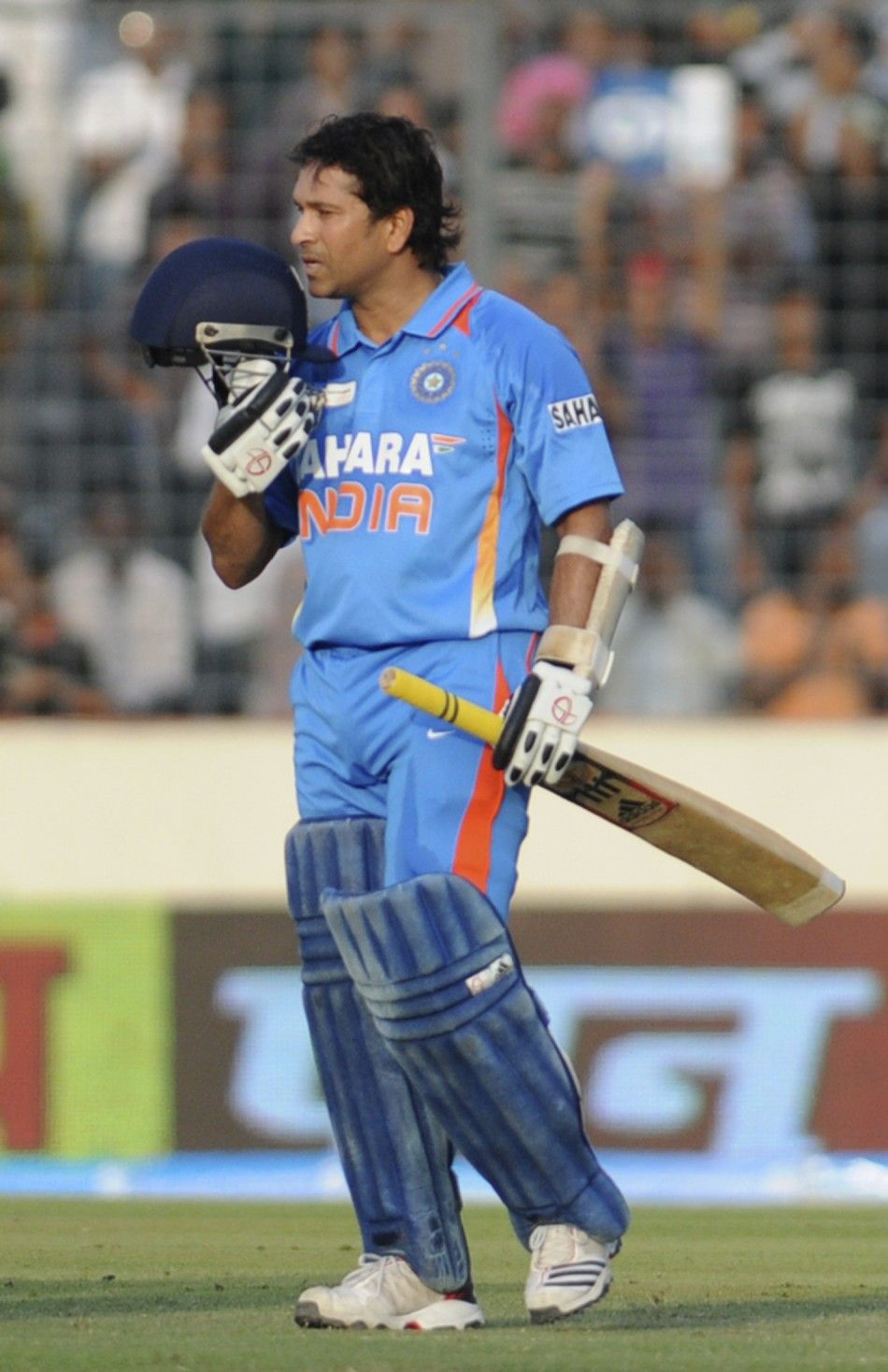 Indias Sachin Tendulkar celebrates after he scored his 100th international centuries against Bangladesh during their One Day International ODI cricket match of Asia Cup in Dhaka March 16, 2012.
