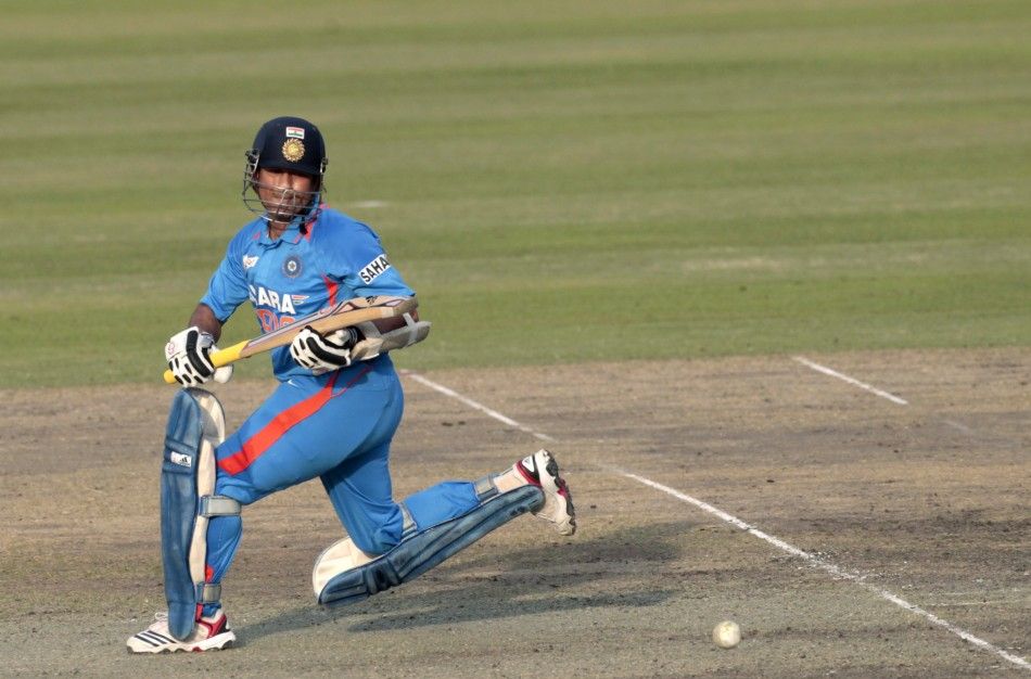 Indias Sachin Tendulkar plays a ball before he scored his 100th centuries against Bangladesh during their One Day International ODI cricket match of Asia Cup in Dhaka March 16, 2012.