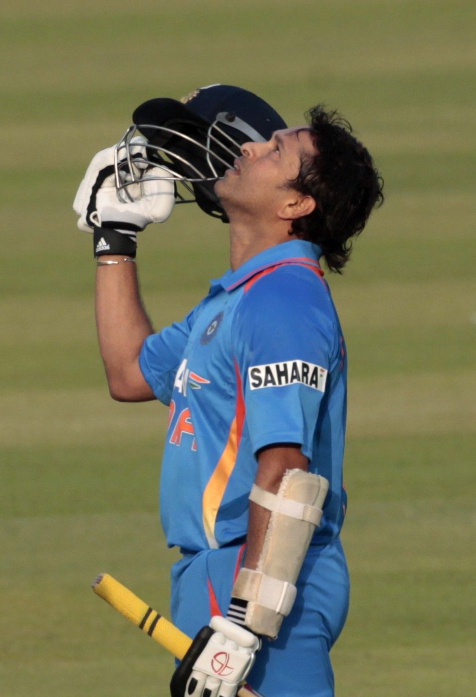 Indias Sachin Tendulkar celebrates after he scored his 100th international century during their Asia Cup one- day international ODI cricket match against Bangladesh in Dhaka March 16, 2012. 