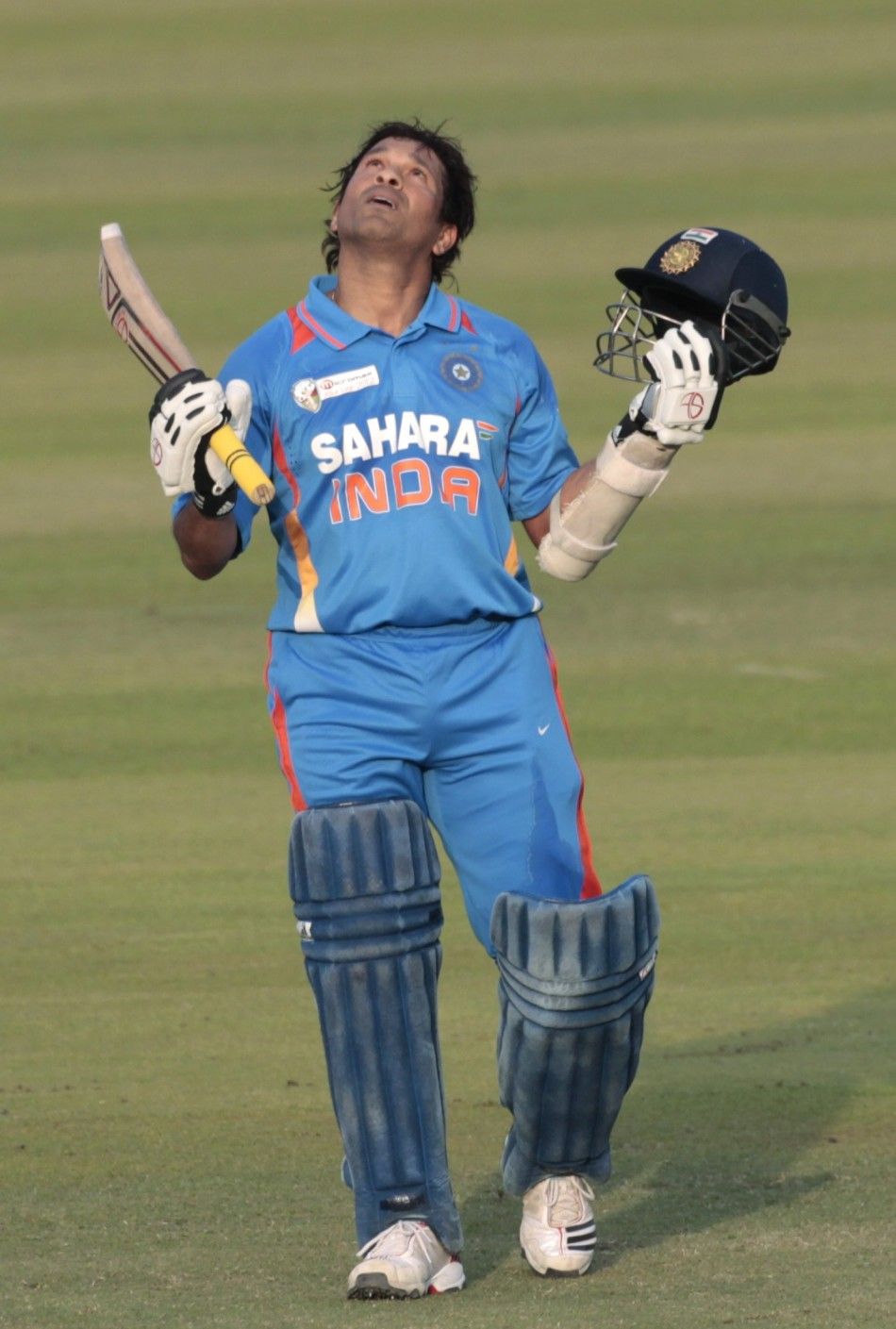 Indias Sachin Tendulkar celebrates after he scored his 100th centuries against Bangladesh during their One Day International ODI cricket match of Asia Cup in Dhaka March 16, 2012.