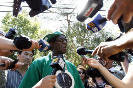 Rapper Flavor Flav is interviewed outside the Jackson family home in Encino