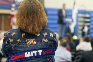 A Mitt Romney supporter listens as U.S. Republican presidential candidate Rick Santorum speaks during an event at Westminster Christian Academy in Town and Country, Missouri, March 17, 2012, the day of the Missouri Republican Caucuses.