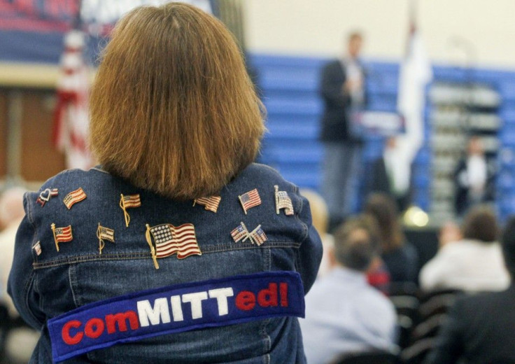 A Mitt Romney supporter listens as U.S. Republican presidential candidate Rick Santorum speaks during an event at Westminster Christian Academy in Town and Country, Missouri, March 17, 2012, the day of the Missouri Republican Caucuses.
