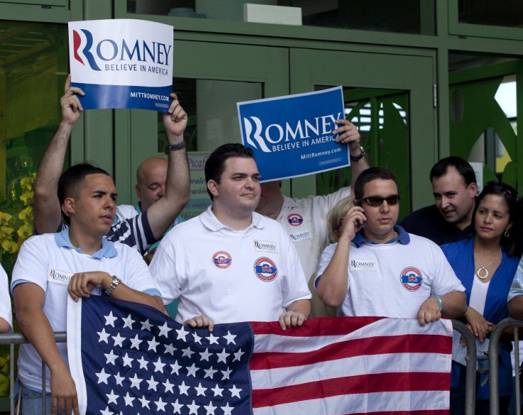 Supporters of U.S. Republican presidential candidate and former Massachusetts Governor Mitt Romney wait outside a market place to greet him on his last day of a two day campaign visit in Bayamon March 17, 2012.