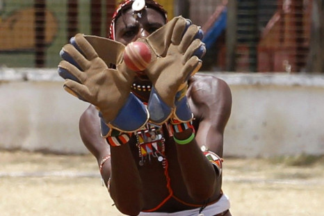 A member of the Maasai Cricket Warriors team catches the ball during their friendly match in Mombasa