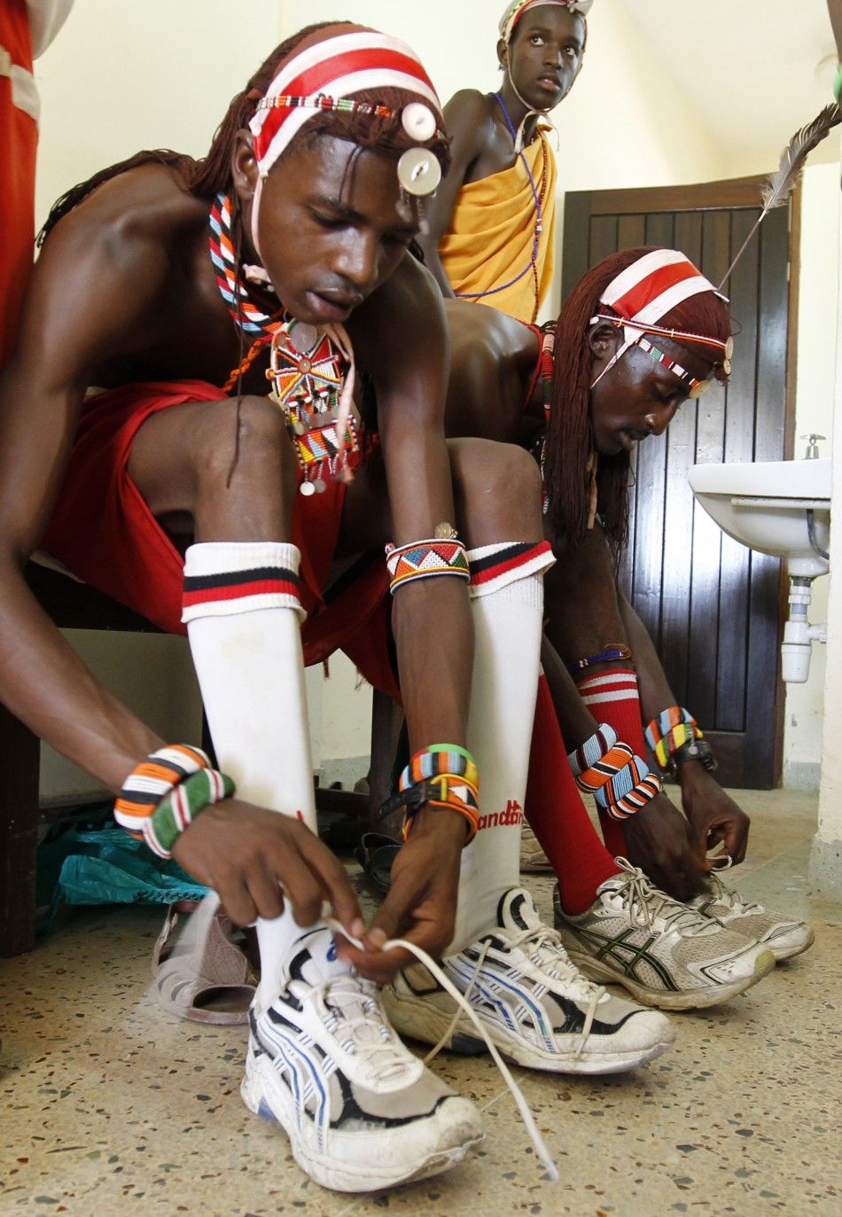 Members of the Maasai Cricket Warriors prepare for their friendly match against the Jafferys team in the Kenyan coastal city of Mombasa