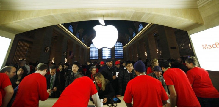 Customers buy Apple products inside the newest Apple Store during its opening on the East Balcony in the main lobby of New York City's Grand Central Station