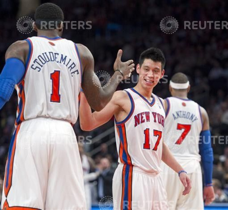 Knicks: Jeremy Lin and Amare Stoudemire celebrate after scoring against Toronto, Carmelo Anthony in background.