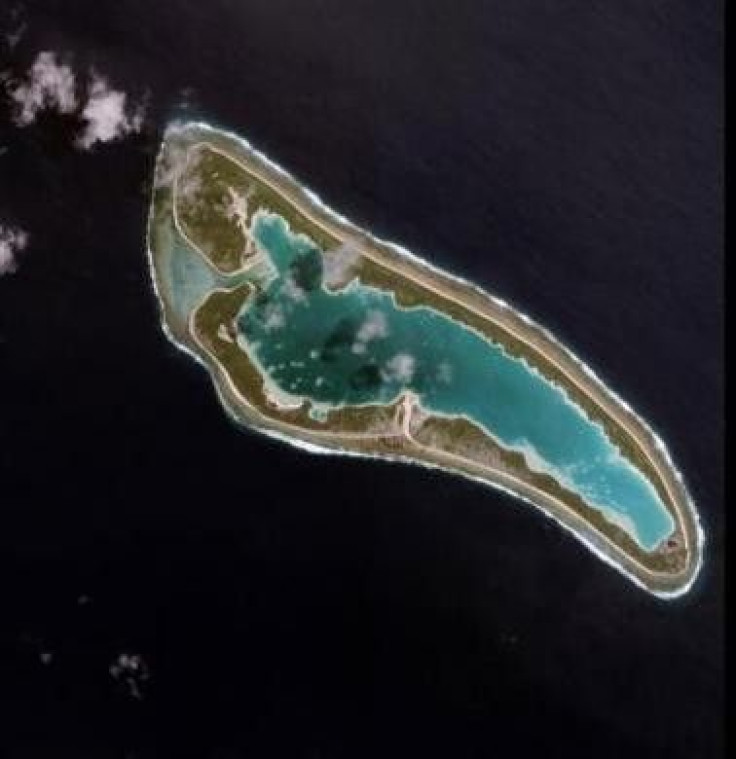 This four-metre resolution image, collected by Space Imaging's IKONOS satellite on April 16, 2001, shows Nikumaroro Island, an uninhabited Pacific coral atoll in the Republic of Kiribati. The atoll is located about 2,000 miles southwest of Hawaii. [R